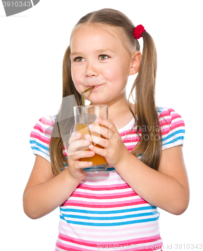 Image of Little girl is drinking carrot juice