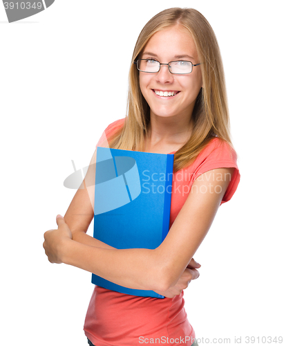 Image of Young student girl is holding book