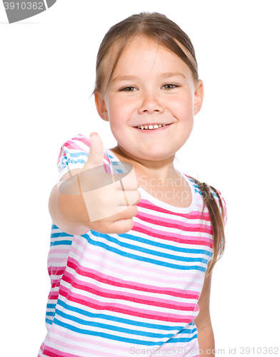 Image of Little girl is showing thumb up gesture