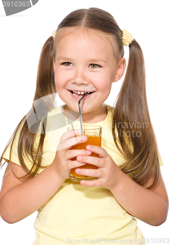 Image of Little girl is drinking carrot juice
