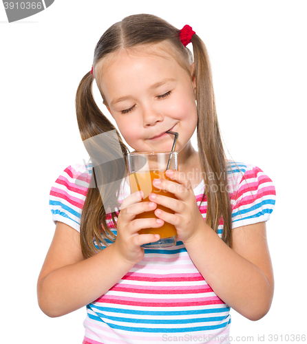 Image of Little girl is drinking carrot juice