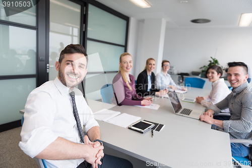 Image of young business people group on team meeting at modern office