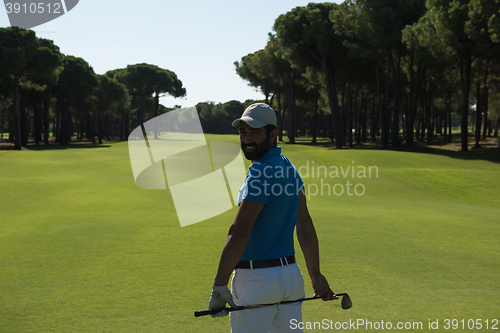 Image of golf player portrait from back