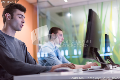 Image of technology students group working  in computer lab school  class