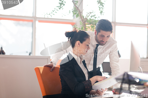 Image of business couple working together on project