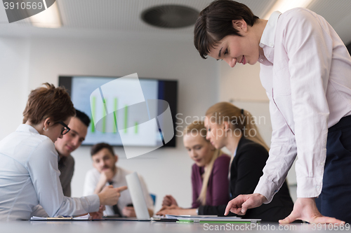 Image of young  woman using  tablet on business meeting