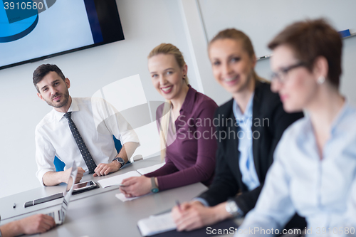 Image of young business people group on team meeting at modern office