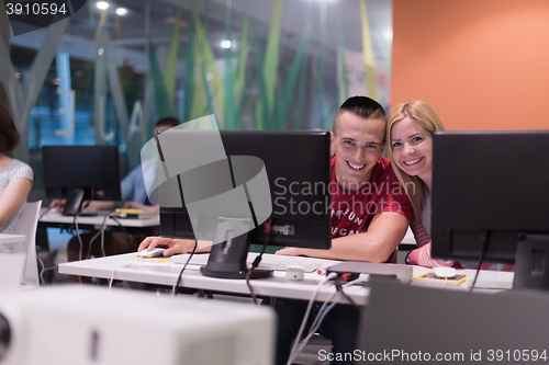 Image of technology students group working in computer lab school  classr