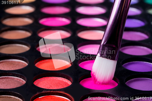 Image of Makeup brushes and make-up eye shadows