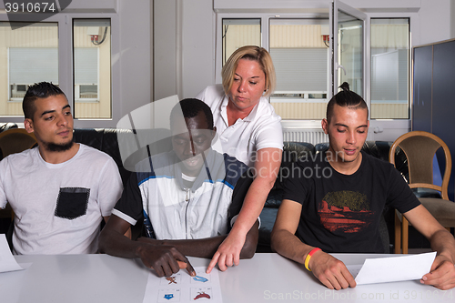 Image of Language training for refugees in a German camp 