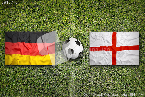 Image of Germany vs. England flags on soccer field
