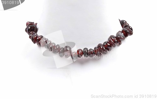 Image of Splintered garnet chain on bust