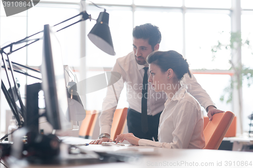 Image of business couple working together on project