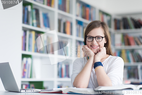 Image of female student study in school library