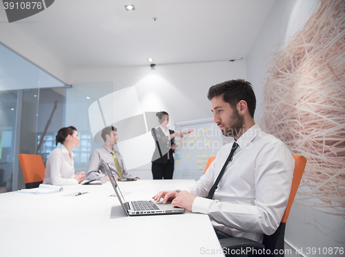 Image of young business man at meeting