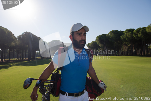 Image of golf player walking