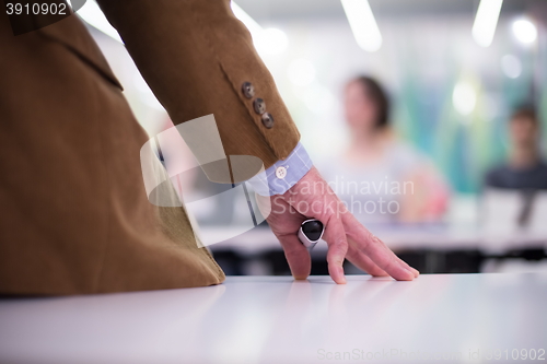 Image of close up of teacher hand while teaching in classroom
