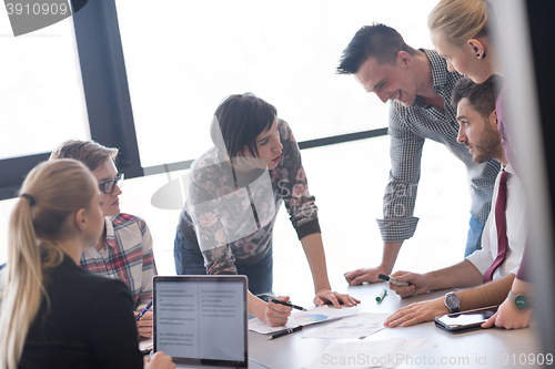 Image of young business people group on meeting at modern office
