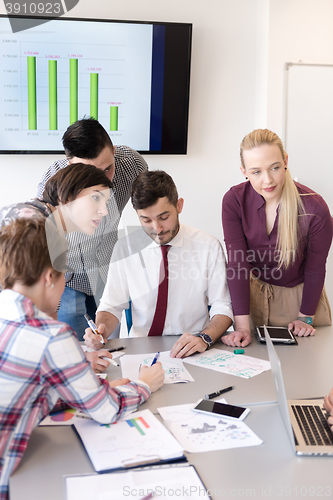 Image of young business people group on meeting at modern office