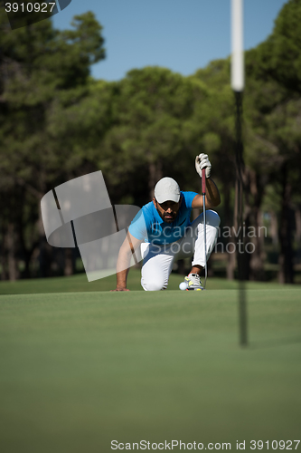 Image of golf player aiming perfect  shot