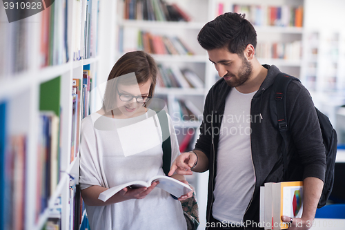 Image of students couple  in school  library