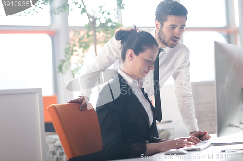 Image of business couple working together on project