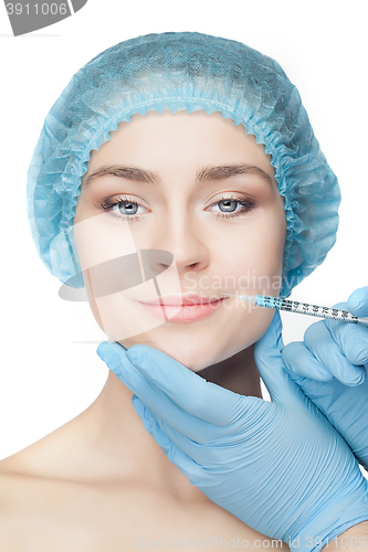 Image of Attractive woman at plastic surgery with syringe in her face