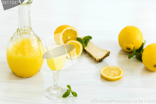 Image of Italian traditional liqueur limoncello with lemon