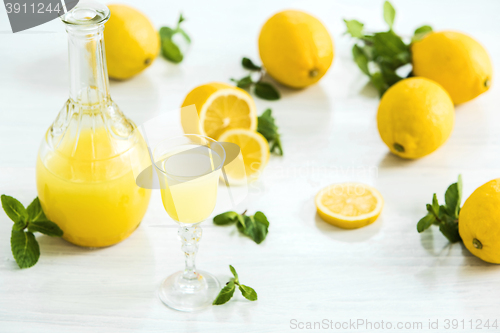 Image of Italian traditional liqueur limoncello with lemon