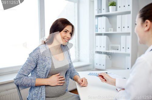 Image of gynecologist doctor and pregnant woman at hospital