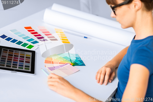 Image of woman working with color samples for selection