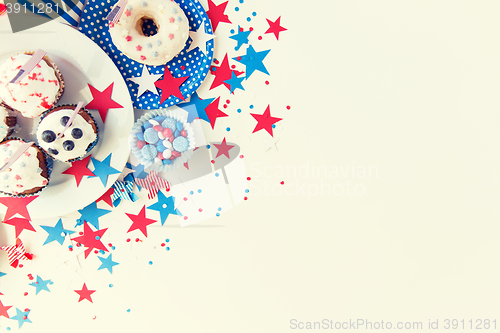 Image of cupcakes with american flags on independence day