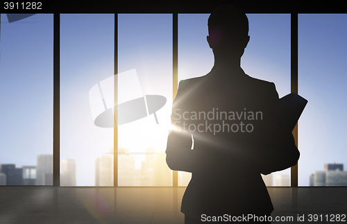 Image of silhouette of business woman with folders