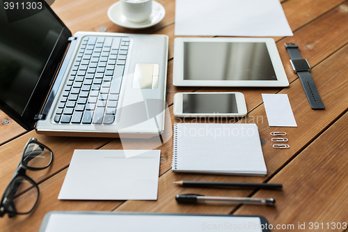 Image of close up of on laptop, tablet pc and smartphone