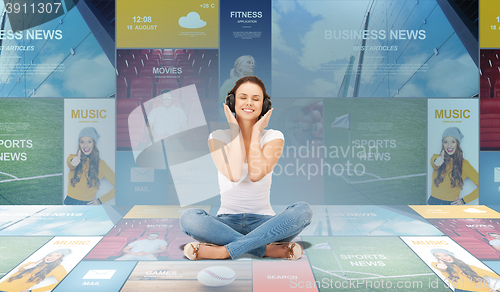 Image of smiling young woman or teen girl in headphones