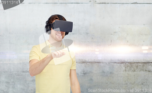 Image of happy man in virtual reality headset or 3d glasses