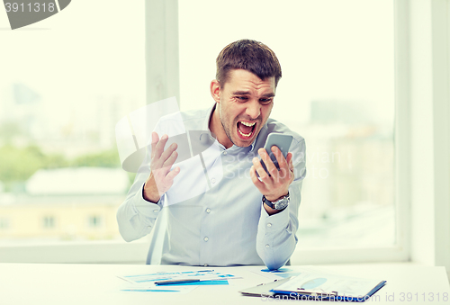 Image of close up of businessman with smartphone