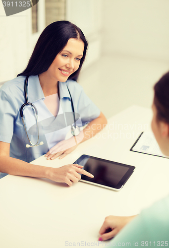 Image of female doctor or nurse with tablet pc computer