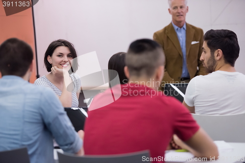 Image of technology students group in computer lab school  classroom