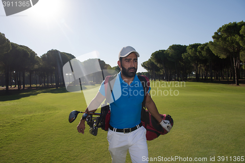 Image of golf player walking