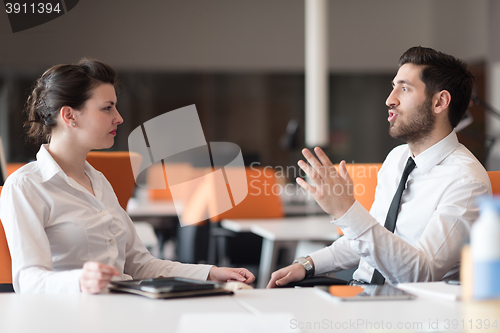 Image of business couple working together on project