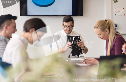 Image of young business people group on team meeting at modern office