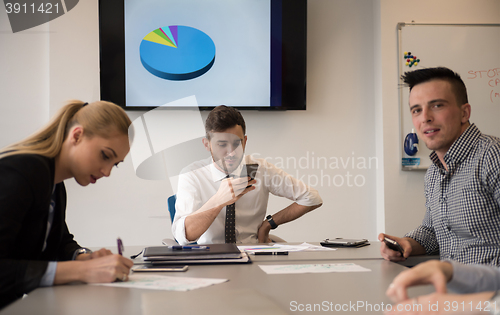 Image of young business people group on meeting at modern office