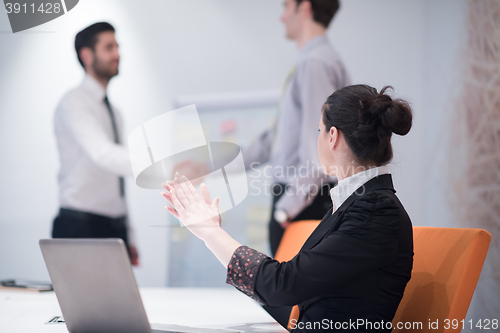 Image of young business woman on meeting  using laptop computer