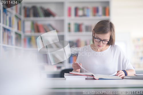 Image of female student study in school library