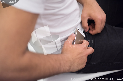 Image of putting phone in pocket