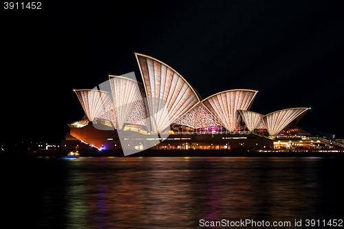 Image of Sydney Opera House in warm coppery tones - Vivid Sydney 2016