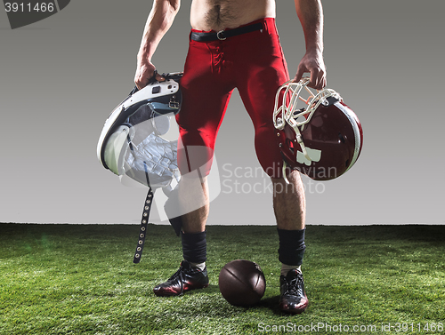 Image of The american football player with ball