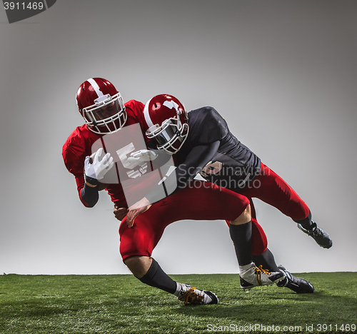 Image of The two american football players in action