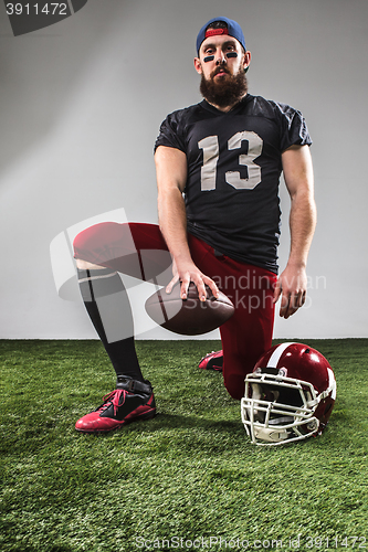 Image of The american football player with ball